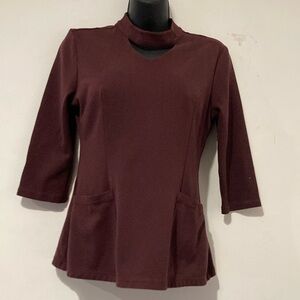 Jaanuu Long Sleeve Scrub Top. Dark brownish burgundy Scrub Top